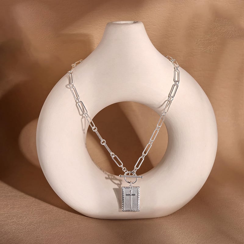 Delicate nail cross necklace